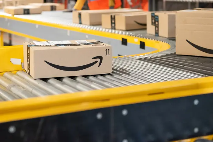 Amazon workers at a company warehouse. OSHA is continuing to investigate two Amazon worker deaths in New Jersey that took place during the summer of 2022, and cleared the company in a third.